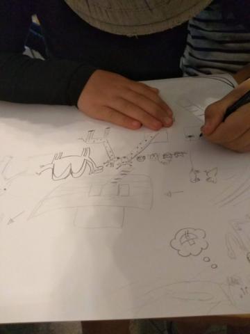 Malý ilustrátor při práci Malý ilustrátor při práci